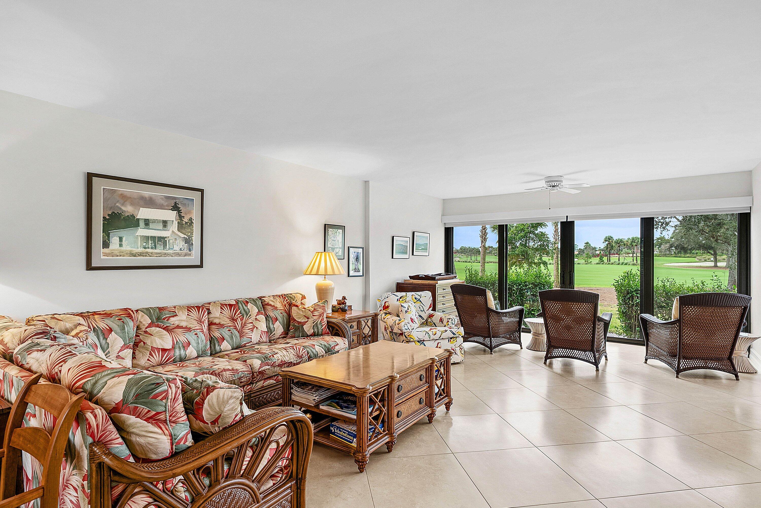10171 Quail Covey Road, Unit HIBISCUS N Boynton Beach, FL 33436 - Photo 12 of 50 a living room with furniture and a large window