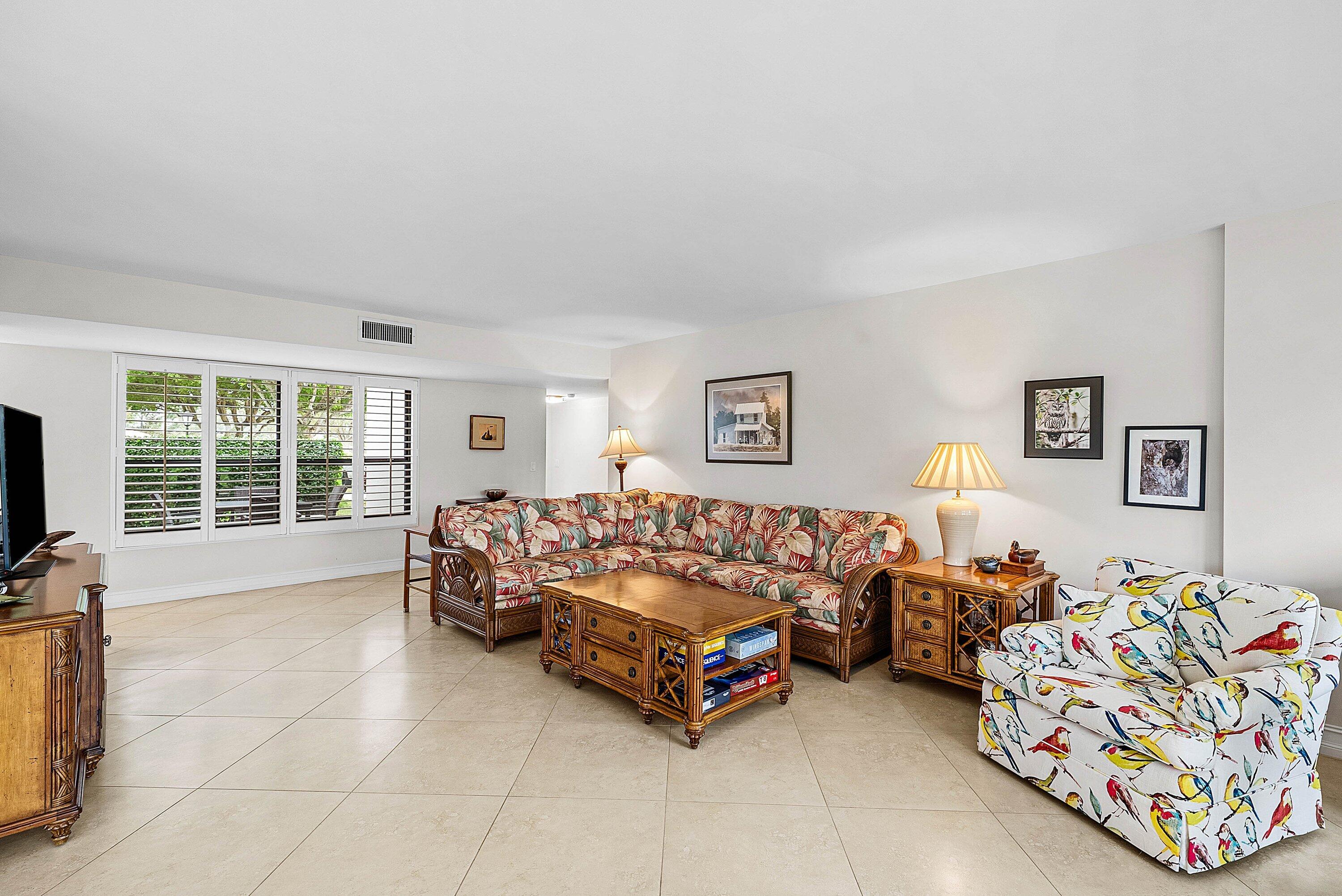 10171 Quail Covey Road, Unit HIBISCUS N Boynton Beach, FL 33436 - Photo 13 of 50 a bed room with couch chair and a window