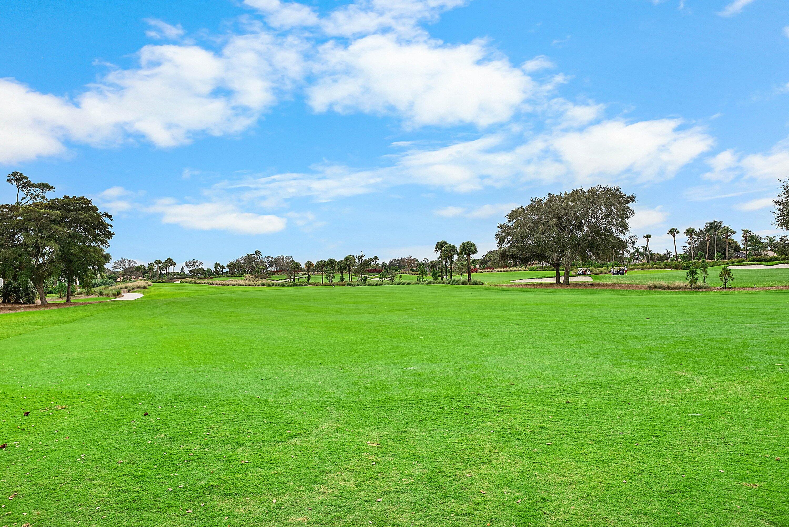 10171 Quail Covey Road, Unit HIBISCUS N Boynton Beach, FL 33436 - Photo 26 of 50 a view of yard with seating space and trampoline