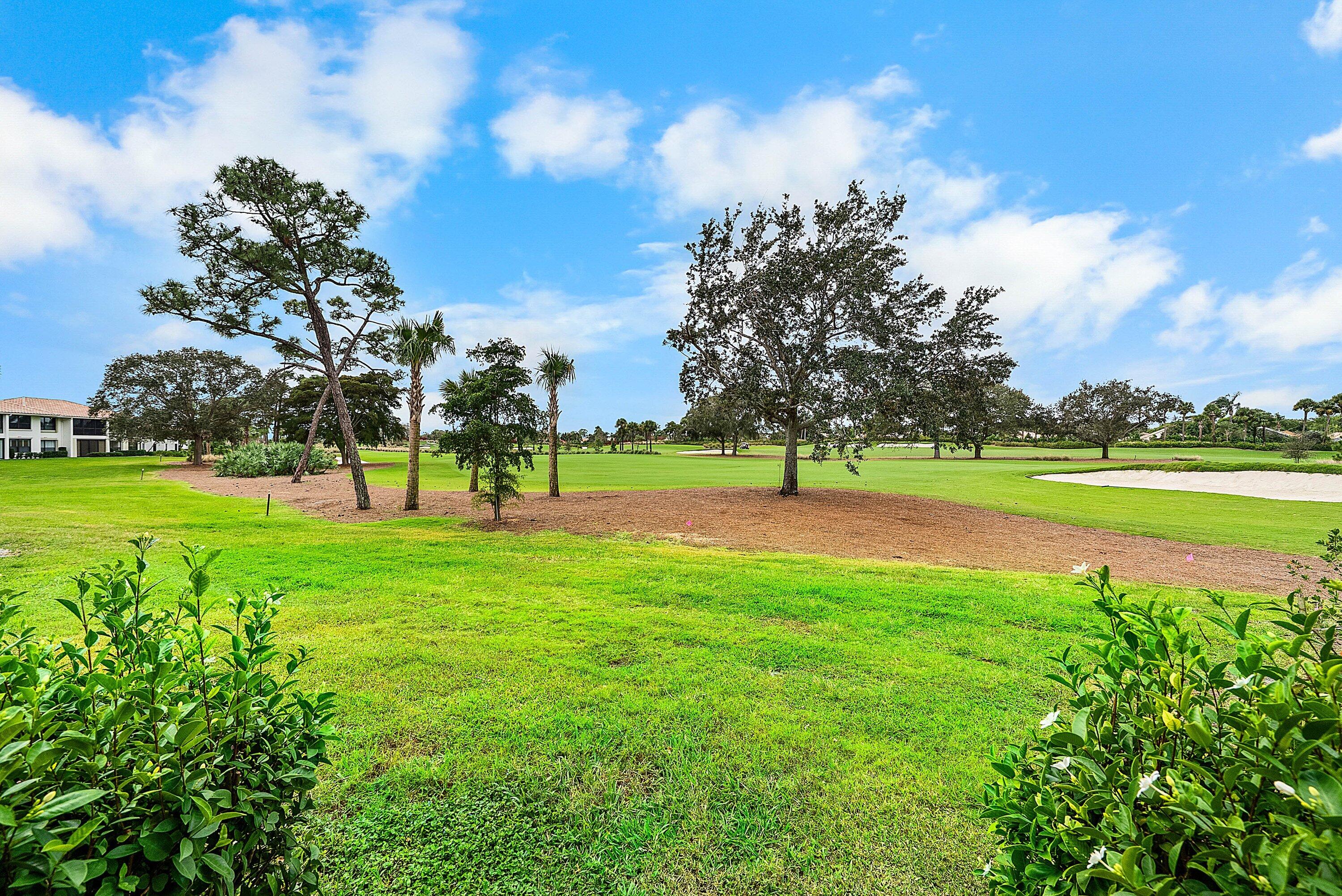 10171 Quail Covey Road, Unit HIBISCUS N Boynton Beach, FL 33436 - Photo 27 of 50 a view of a park with large trees
