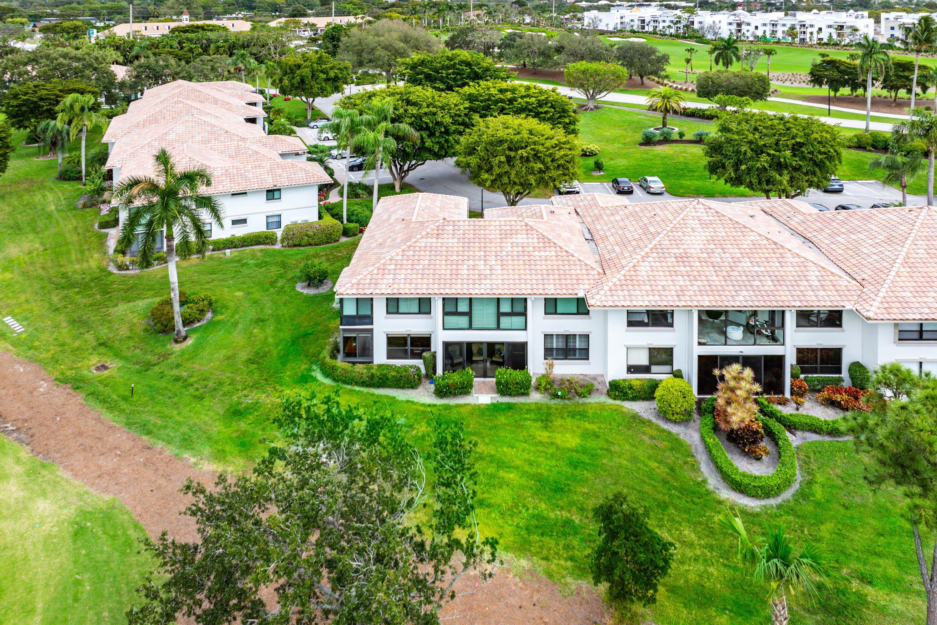 10171 Quail Covey Road, Unit HIBISCUS N Boynton Beach, FL 33436 - Photo 33 of 50 an aerial view of a house with swimming pool garden and patio