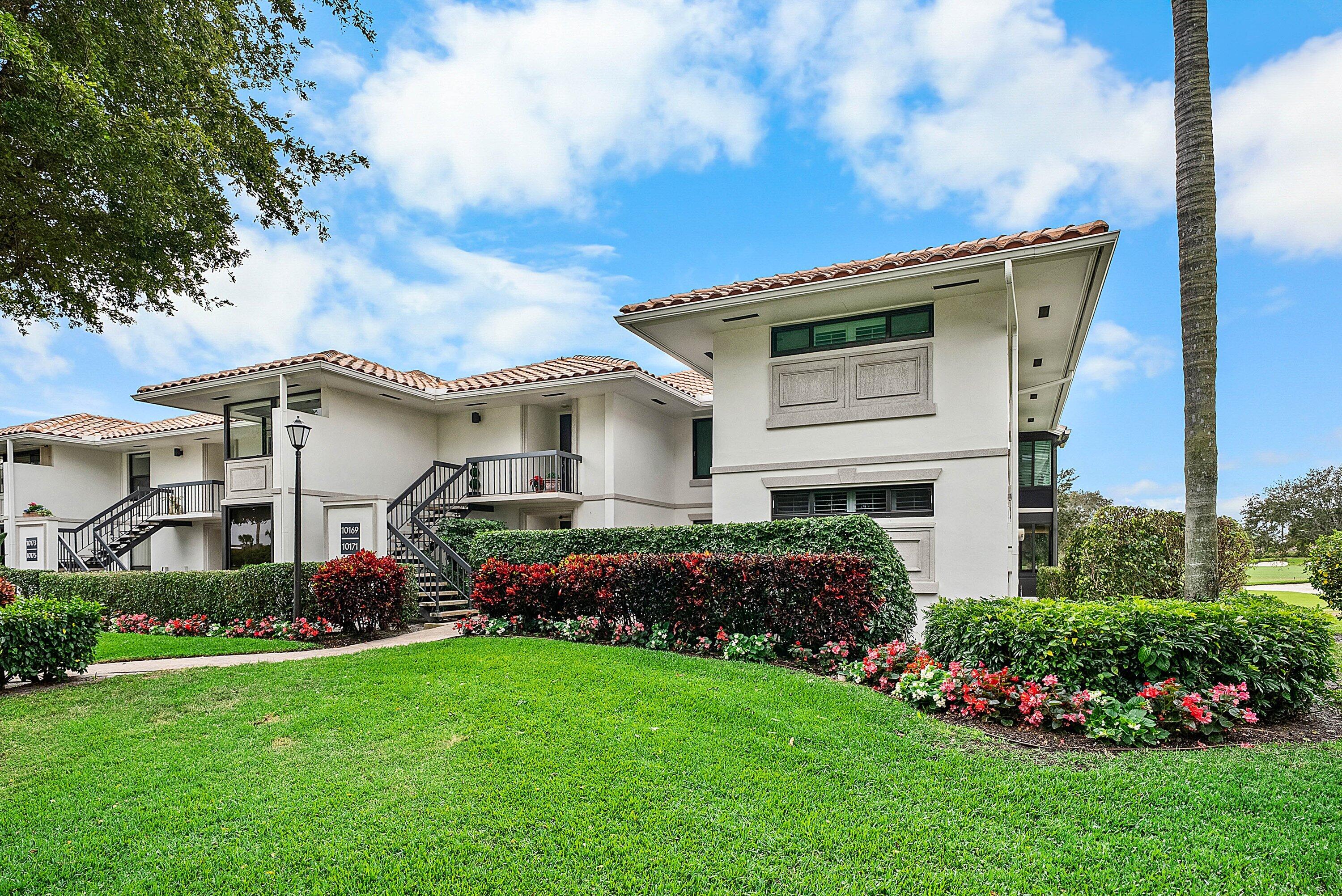 10171 Quail Covey Road, Unit HIBISCUS N Boynton Beach, FL 33436 - Photo 38 of 50 a front view of house with yard and green space