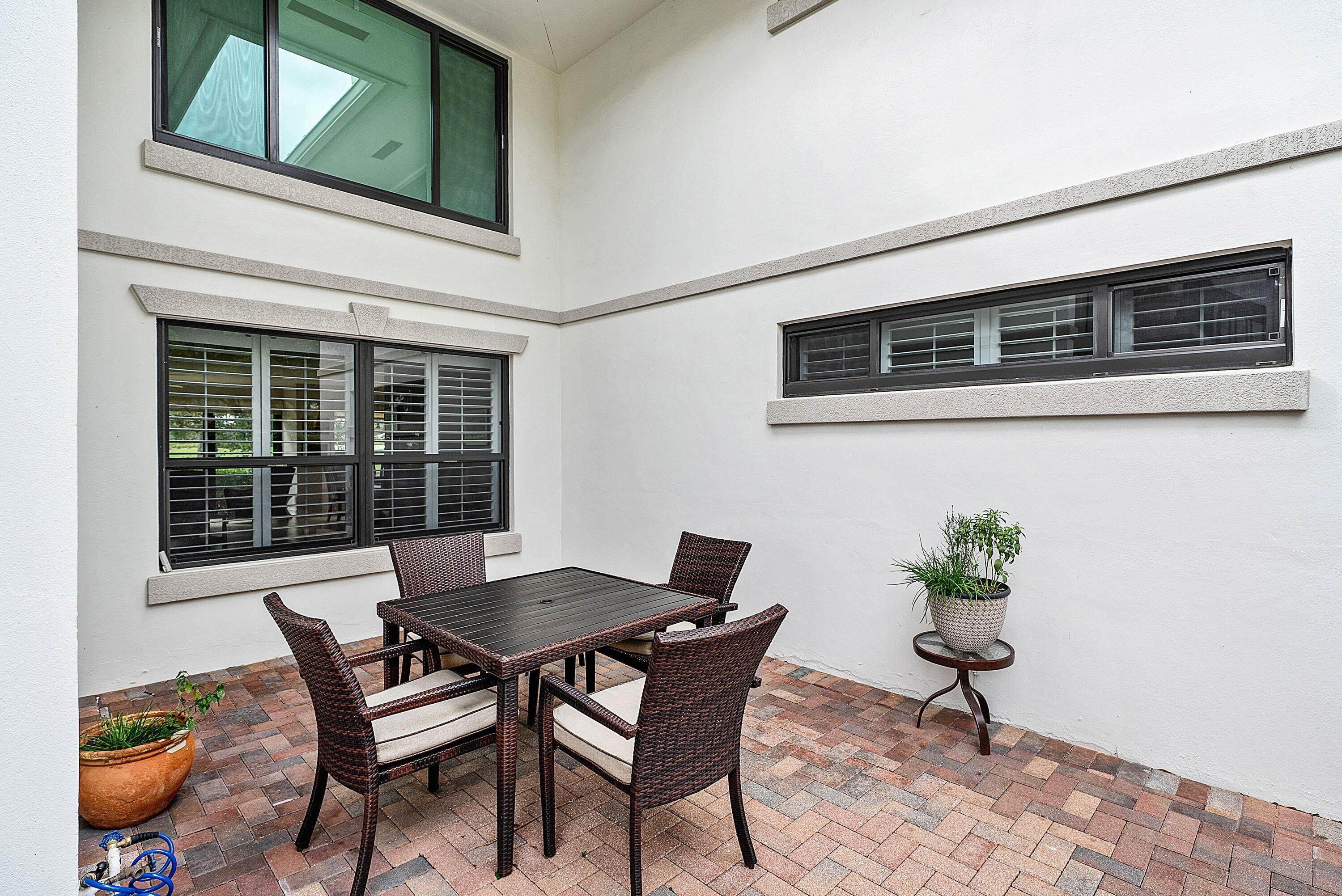 10171 Quail Covey Road, Unit HIBISCUS N Boynton Beach, FL 33436 - Photo 40 of 50 a dining room with furniture and window