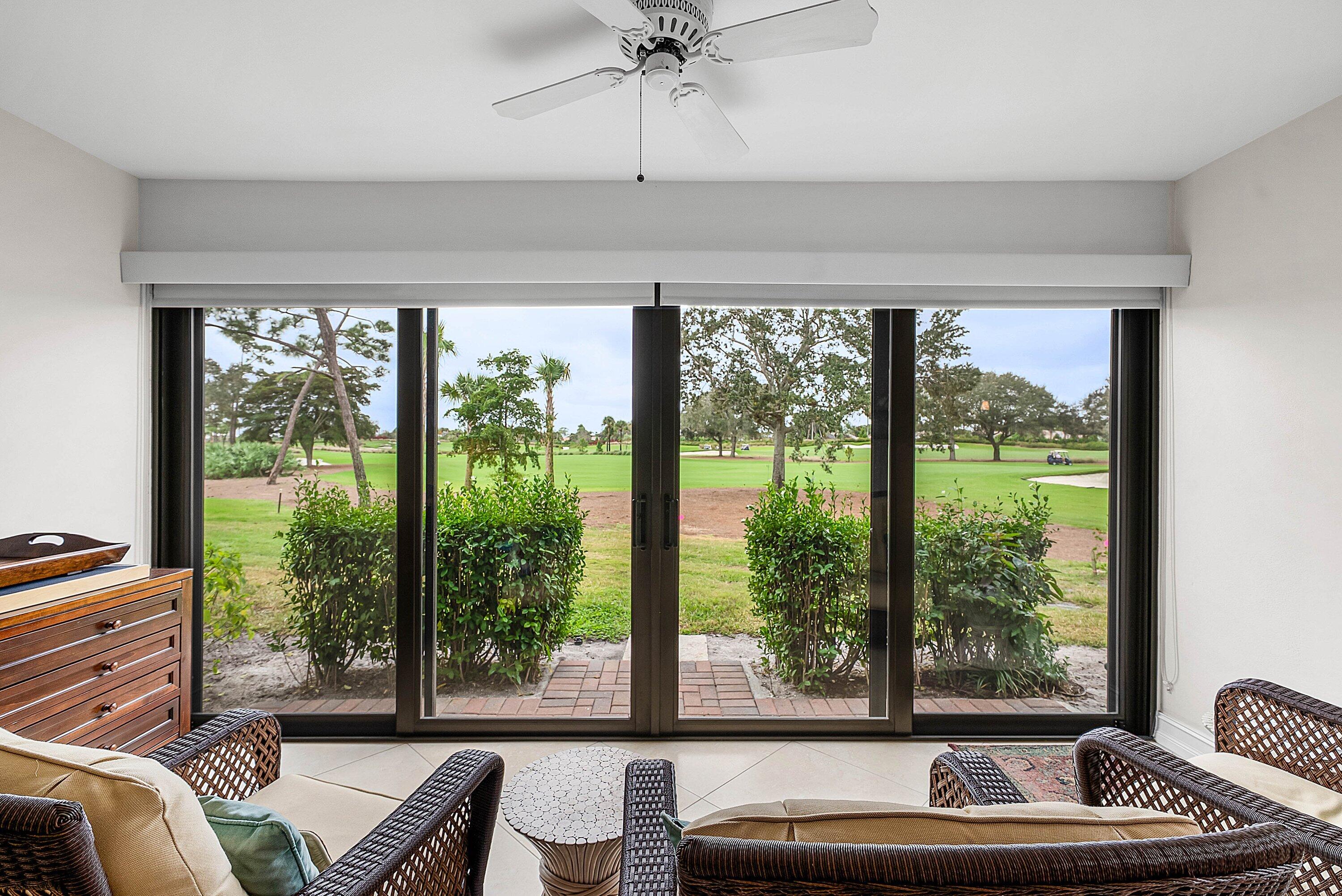 10171 Quail Covey Road, Unit HIBISCUS N Boynton Beach, FL 33436 - Photo 4 of 50 a living room with furniture and a large window