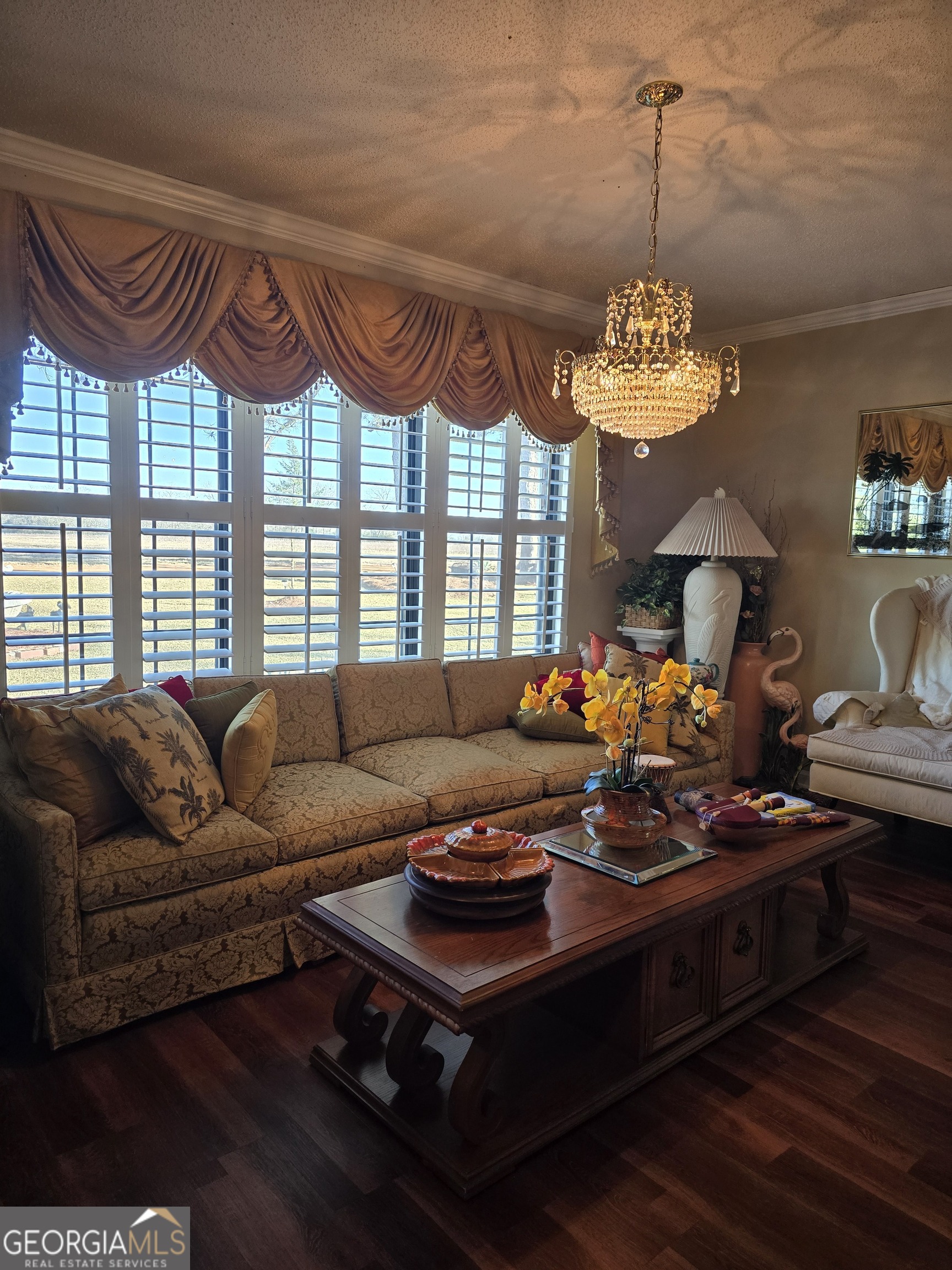 479 Mitchell Loop Bluffton, GA 39824 - Photo 21 of 51 a living room with furniture a chandelier and a chandelier