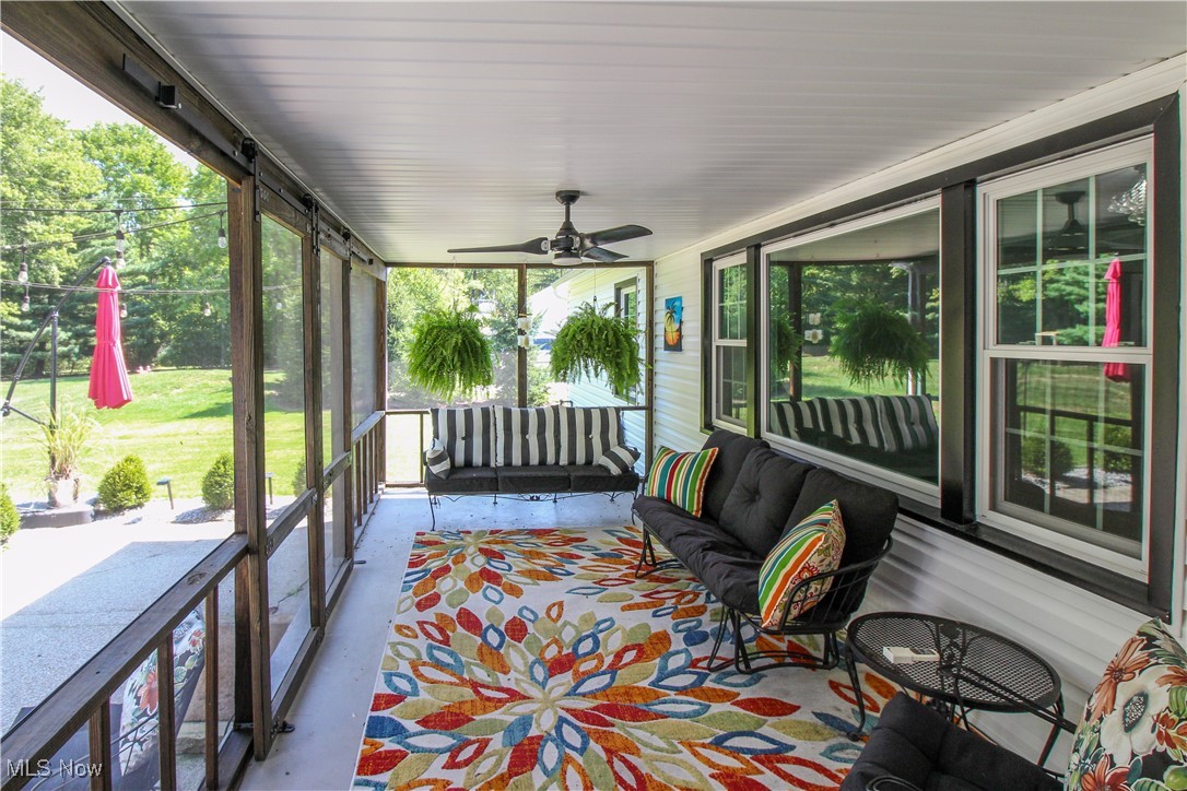 207 Harmon Road Aurora, OH 44202 - Photo 34 of 40 View screened in porch and patio area to the left.