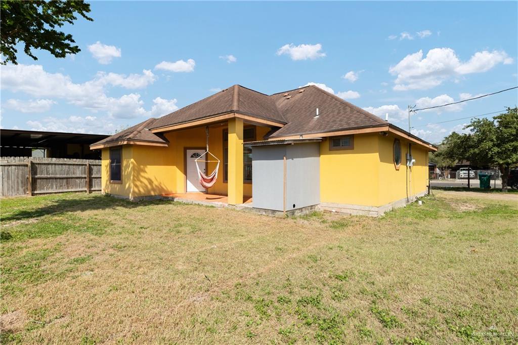 240 East Dicker Road Pharr, TX 78577 - Photo 9 of 11 a front view of a house with a yard and garage