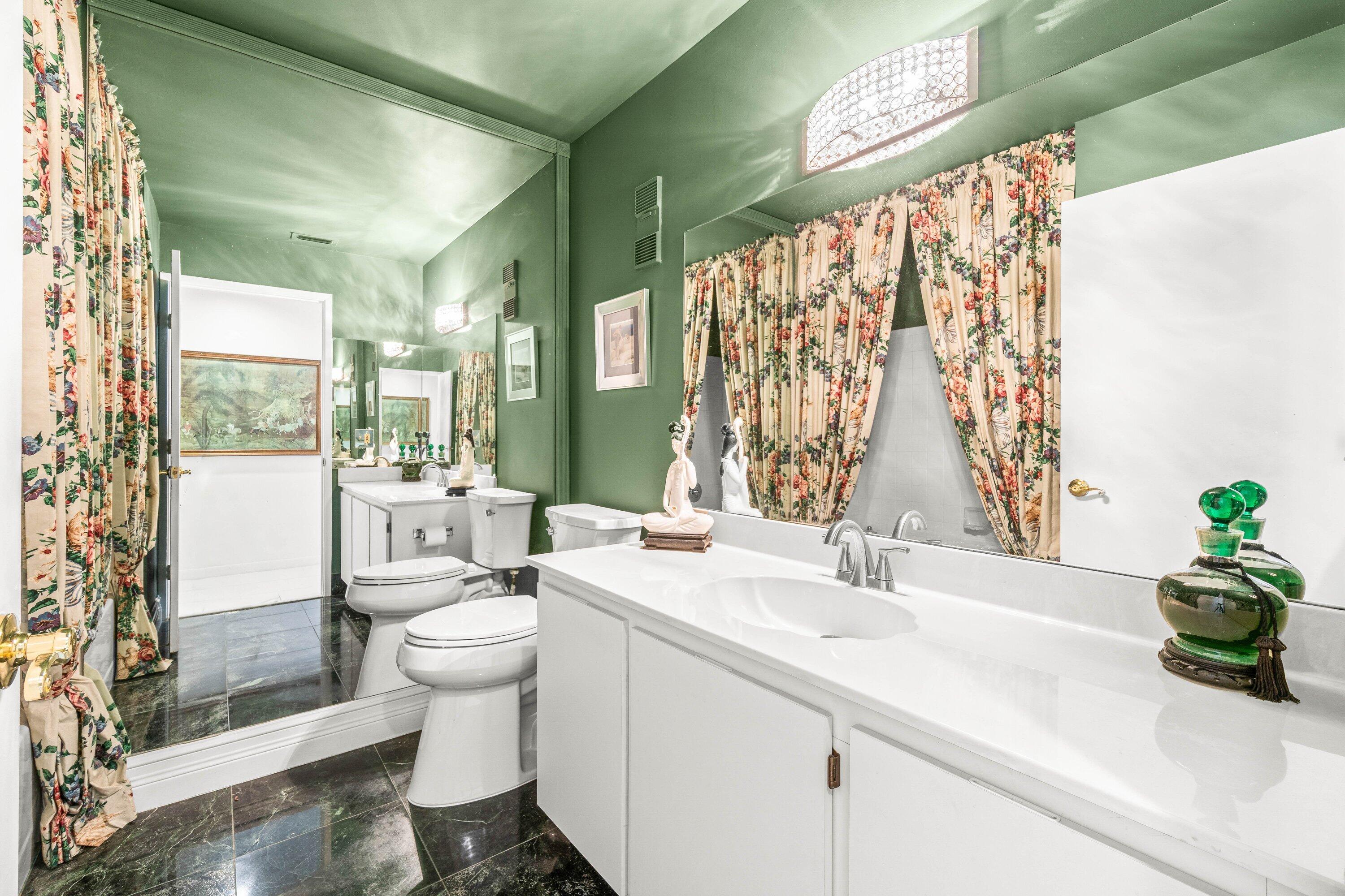 8191 Whispering Palm Drive Boca Raton, FL 33496 - Photo 20 of 34 a bathroom with a sink a toilet and shower