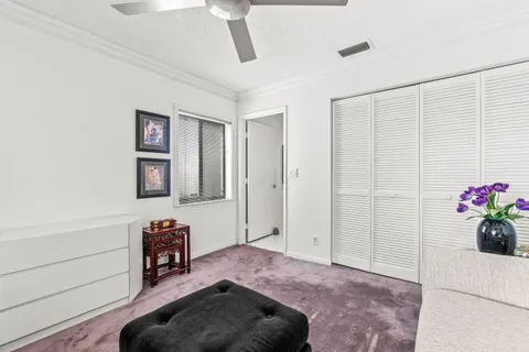 a living room with furniture and flowers