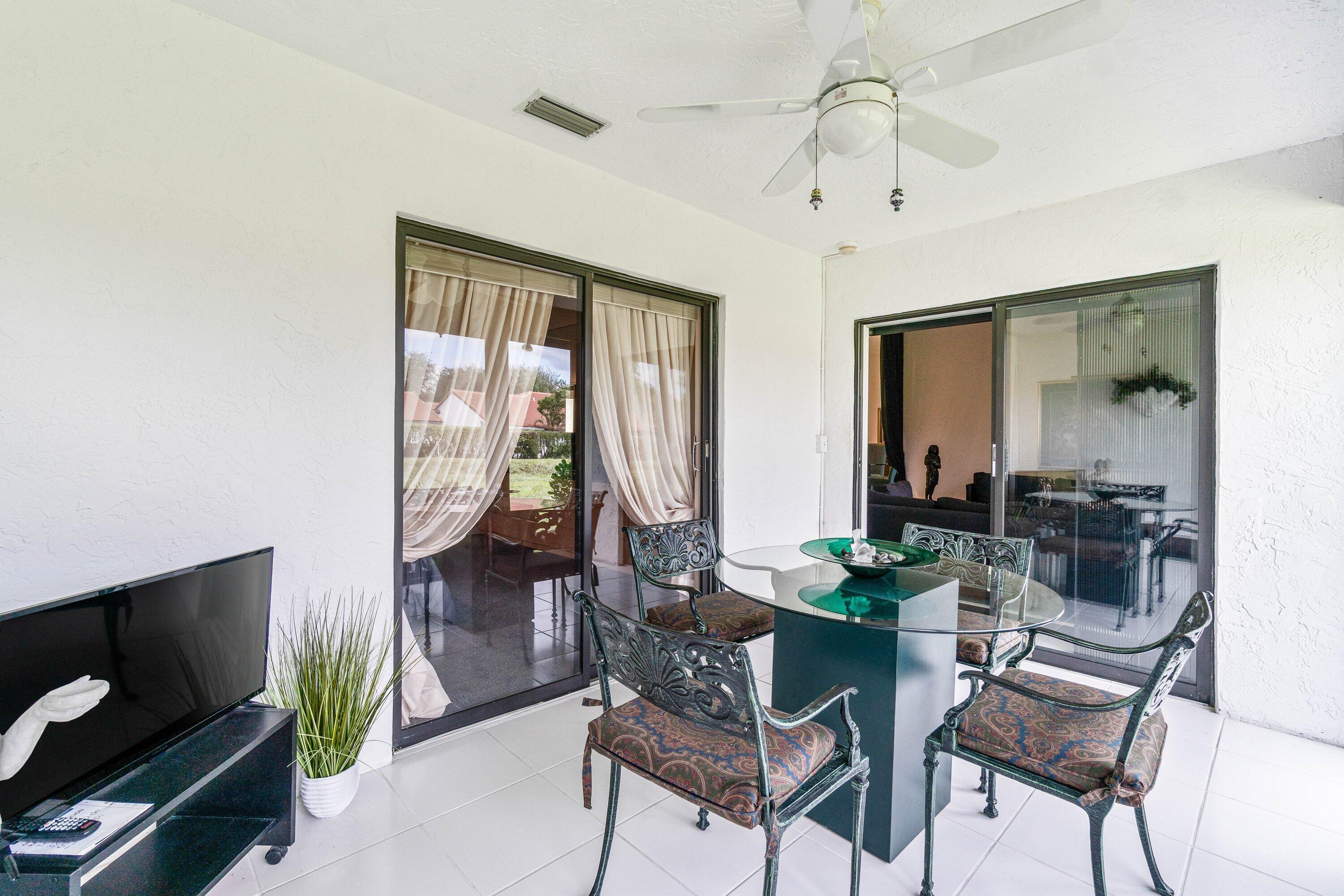 8191 Whispering Palm Drive Boca Raton, FL 33496 - Photo 24 of 34 a dining room with furniture and window