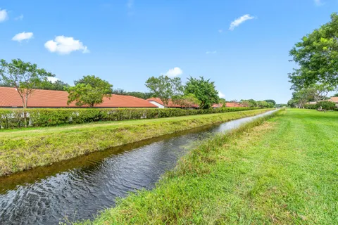 a view of a lake with a yard