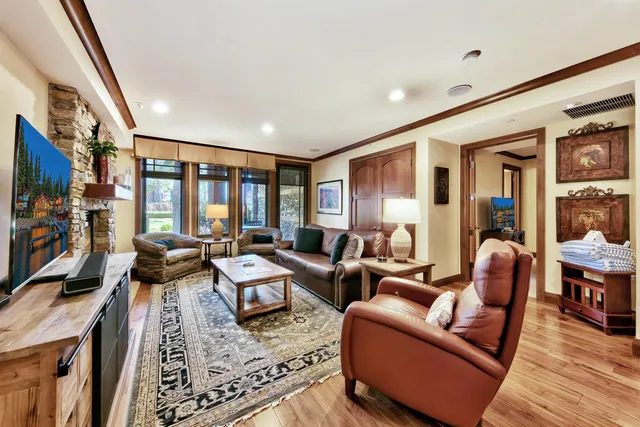 a living room with furniture fireplace and a flat screen tv