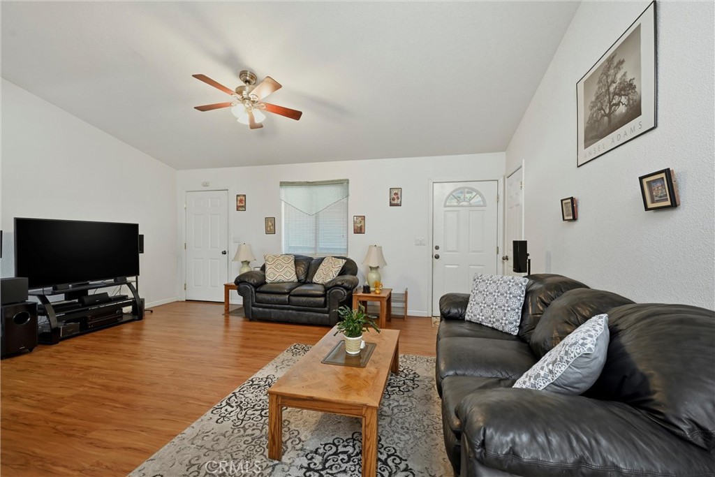 18685 Oak Grove Road Hidden Valley Lake, CA 95467 - Photo 6 of 52 a living room with furniture and a flat screen tv