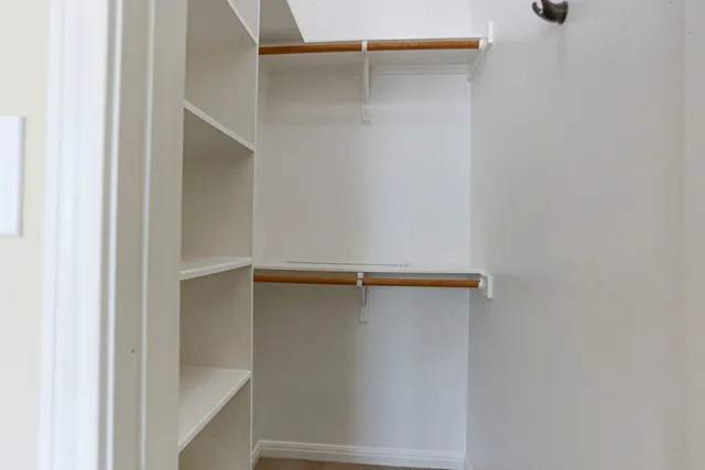 a view of an empty walk in closet