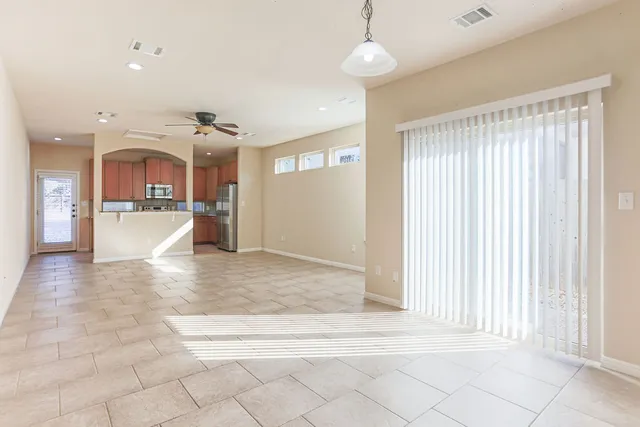 a view of a livingroom with furniture and a window