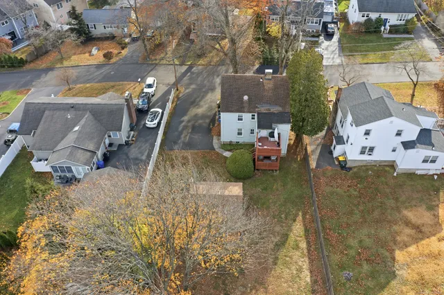 an aerial view of a house with swimming pool