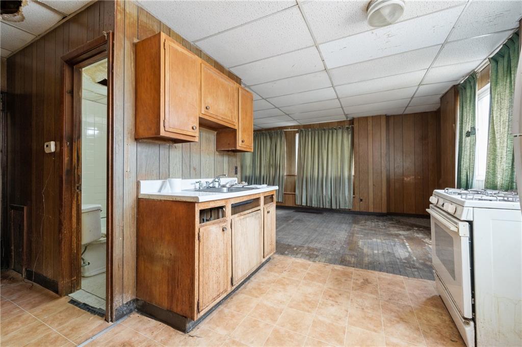 200 Helen Street McKees Rocks, PA 15136 - Photo 12 of 23 a kitchen with a stove and a refrigerator