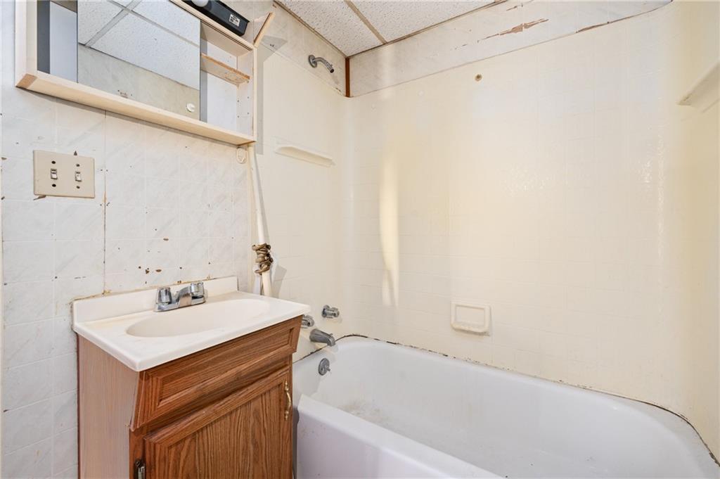 200 Helen Street McKees Rocks, PA 15136 - Photo 10 of 23 a bathroom with a sink and a bathtub