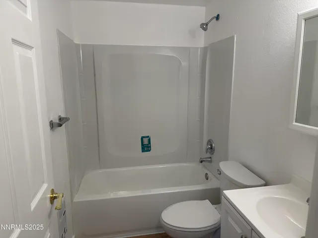 a bathroom with a sink a mirror and vanity