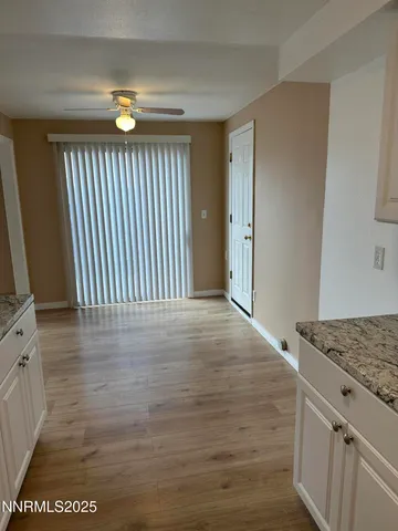 a kitchen with granite countertop a sink and a stove top oven