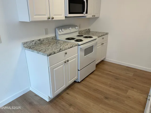 a view of staircase with white walls