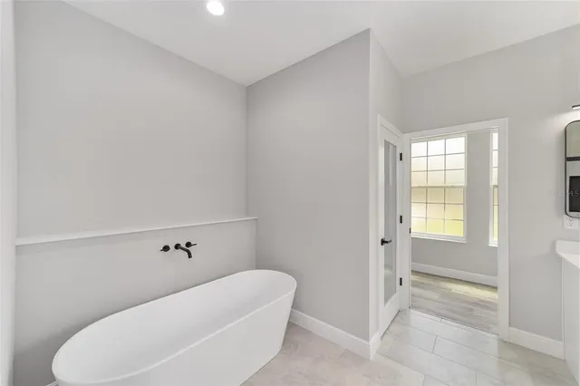 a view of an house with backyard space and garden