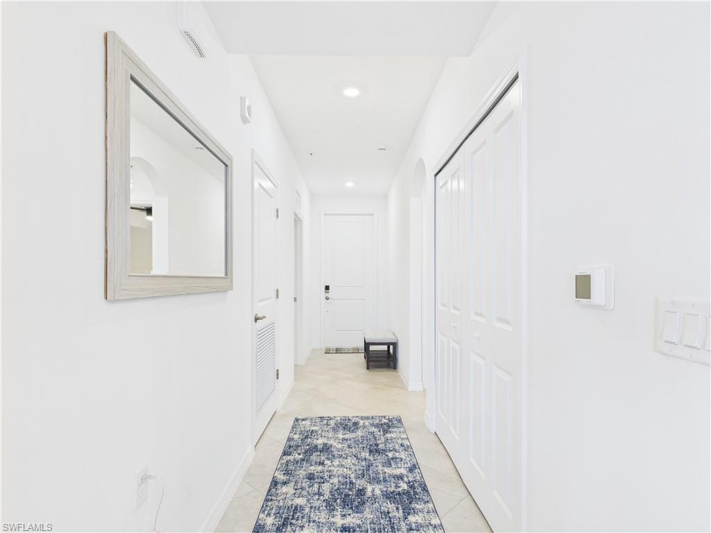 5527 Double Eagle Circle, Unit 3817 Ave Maria, FL 34142 - Photo 7 of 26 a bathroom with a sink and a mirror