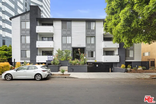a view of a cars parked in front of a building