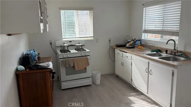 a kitchen with a stove and a sink