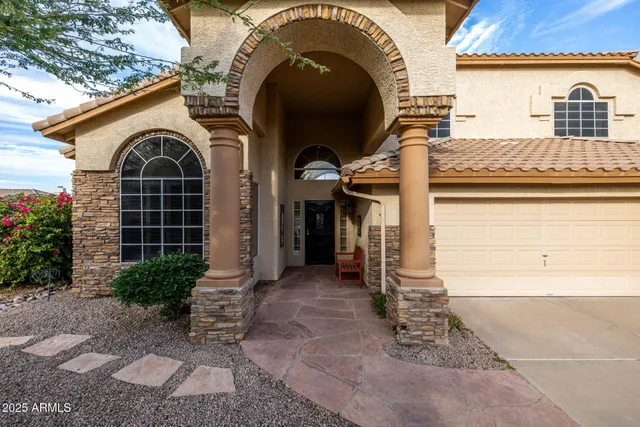 a view of a livingroom with white and furniture