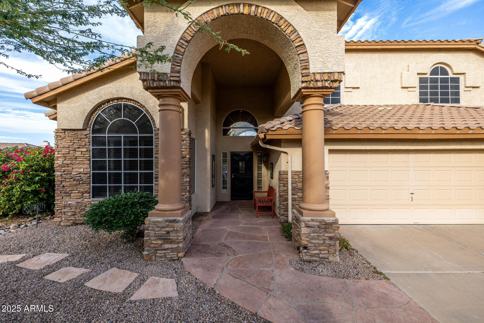 6726 East Villeroy Circle Mesa, AZ 85215 - Photo 14 of 74 a front view of a house with garden