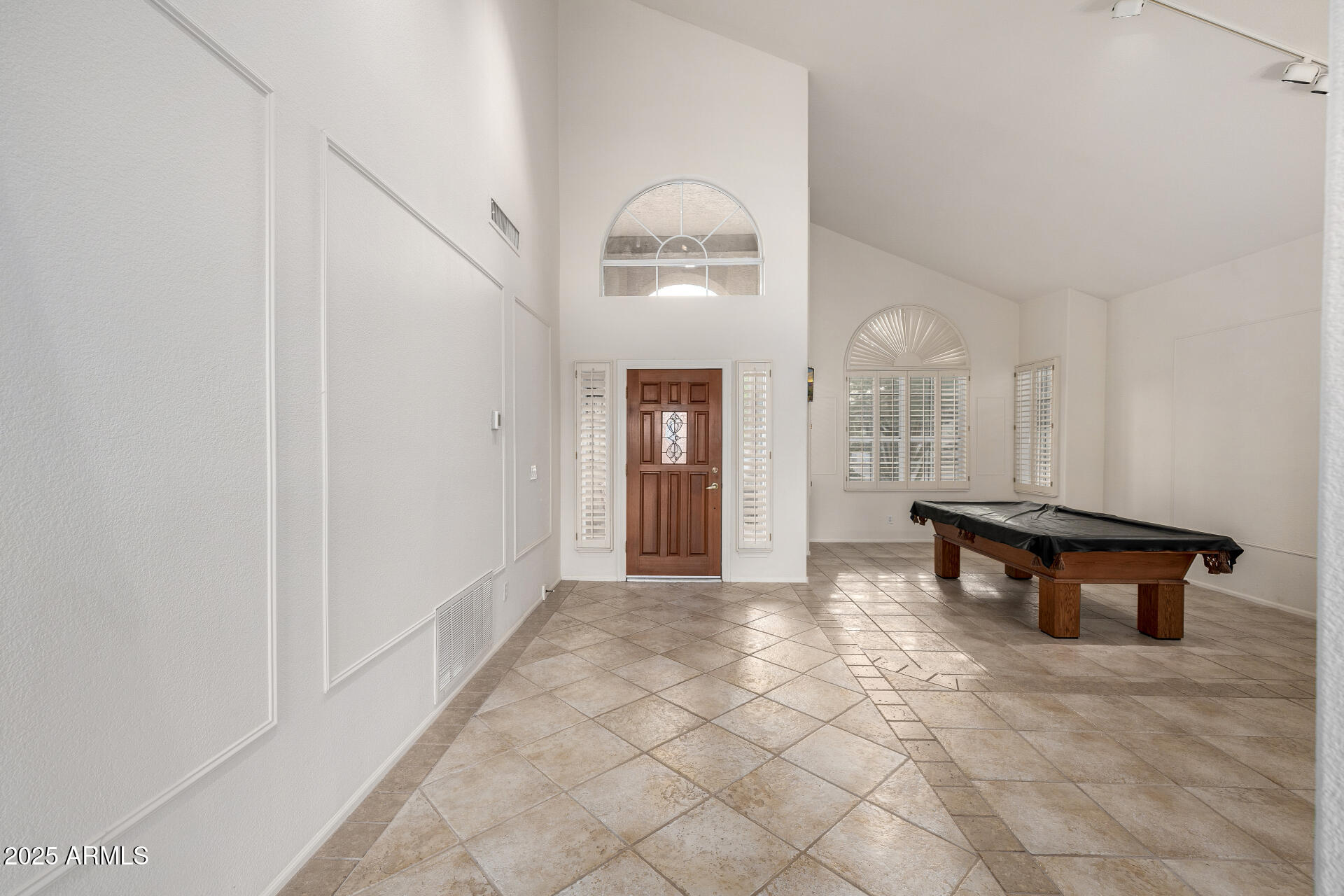 6726 East Villeroy Circle Mesa, AZ 85215 - Photo 15 of 74 a view of a livingroom with wooden floor and a hallway