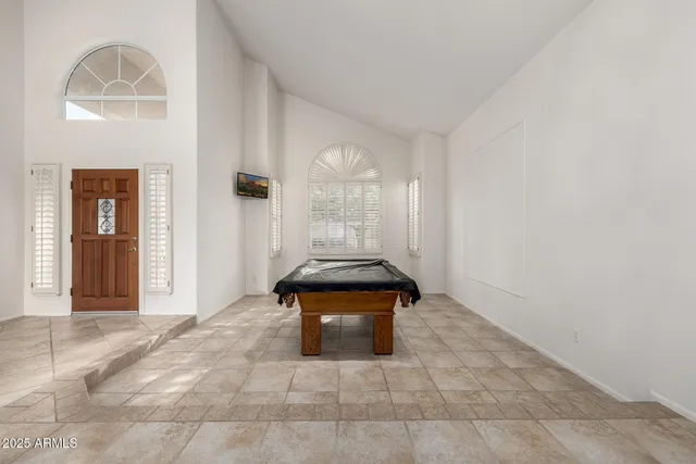a kitchen with stainless steel appliances kitchen island granite countertop a sink and cabinets