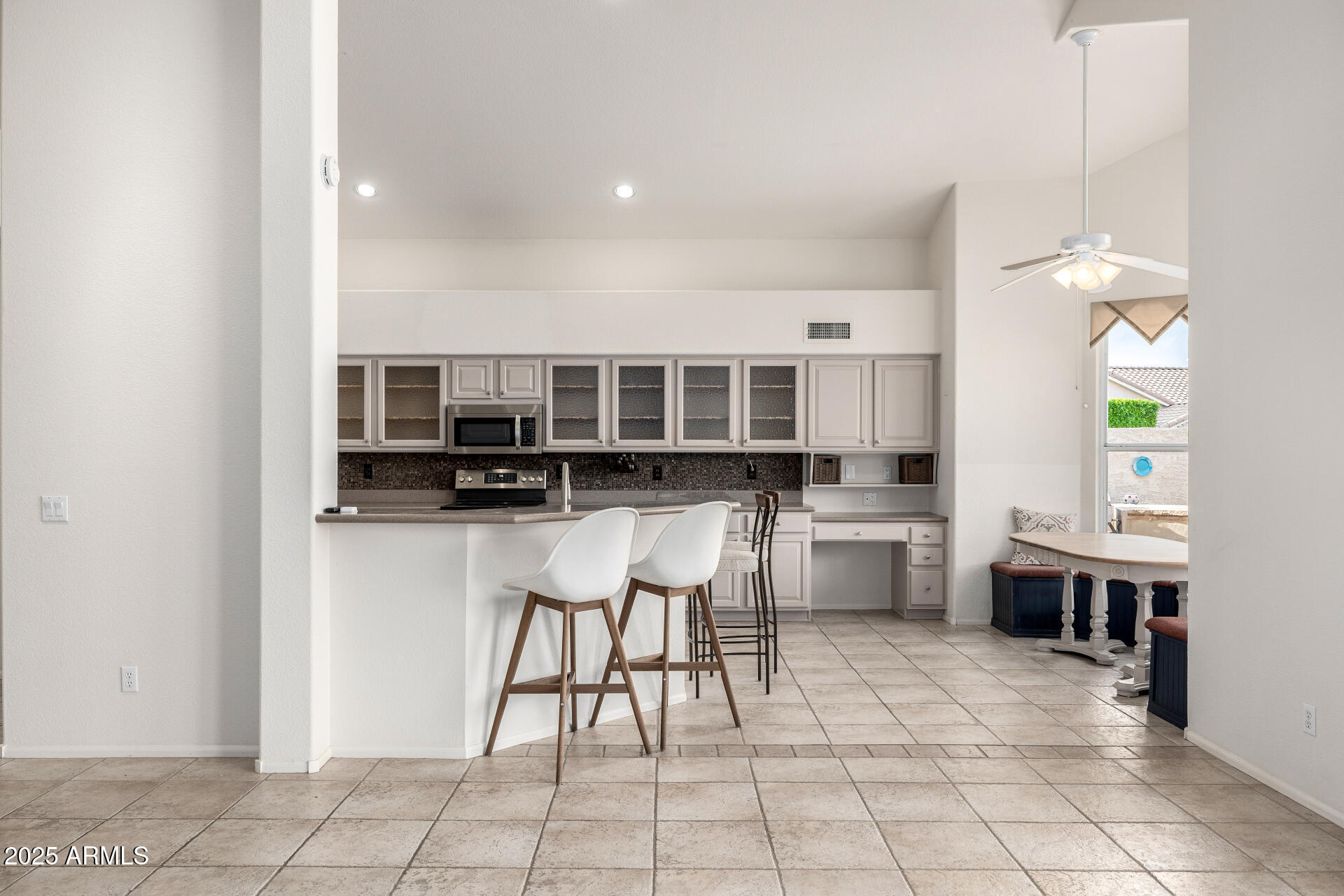 6726 East Villeroy Circle Mesa, AZ 85215 - Photo 24 of 74 a kitchen with stainless steel appliances kitchen island granite countertop a sink and cabinets