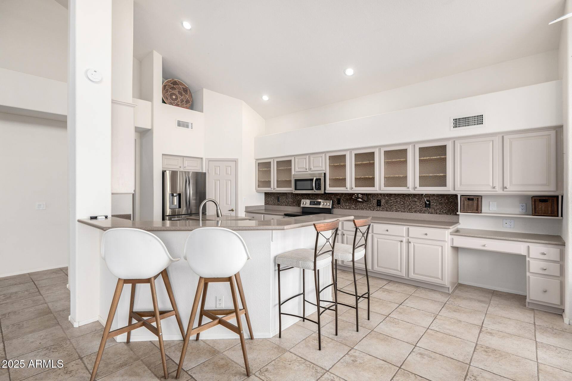 6726 East Villeroy Circle Mesa, AZ 85215 - Photo 25 of 74 a kitchen with stainless steel appliances kitchen island granite countertop a sink and cabinets