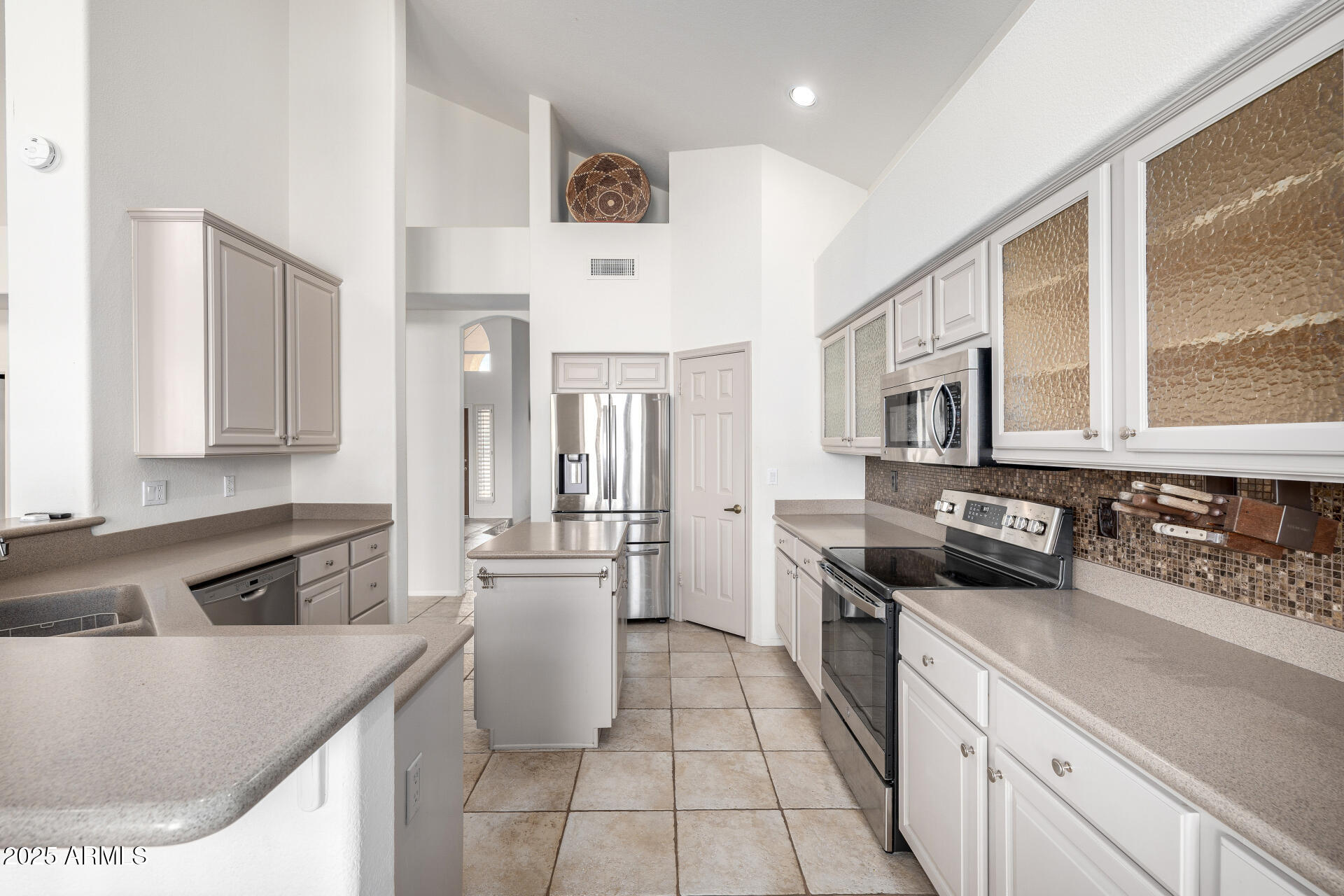 6726 East Villeroy Circle Mesa, AZ 85215 - Photo 26 of 74 a kitchen with stainless steel appliances granite countertop a stove a sink and a refrigerator