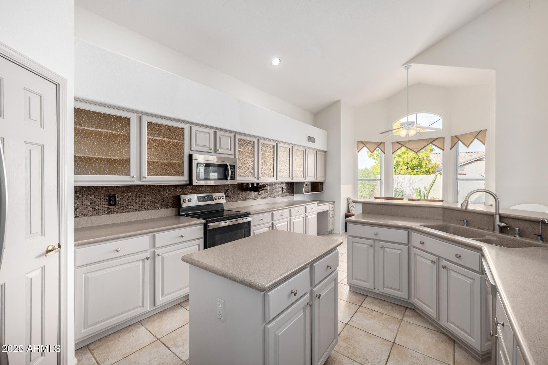 6726 East Villeroy Circle Mesa, AZ 85215 - Photo 28 of 74 a kitchen with a sink stove and cabinets
