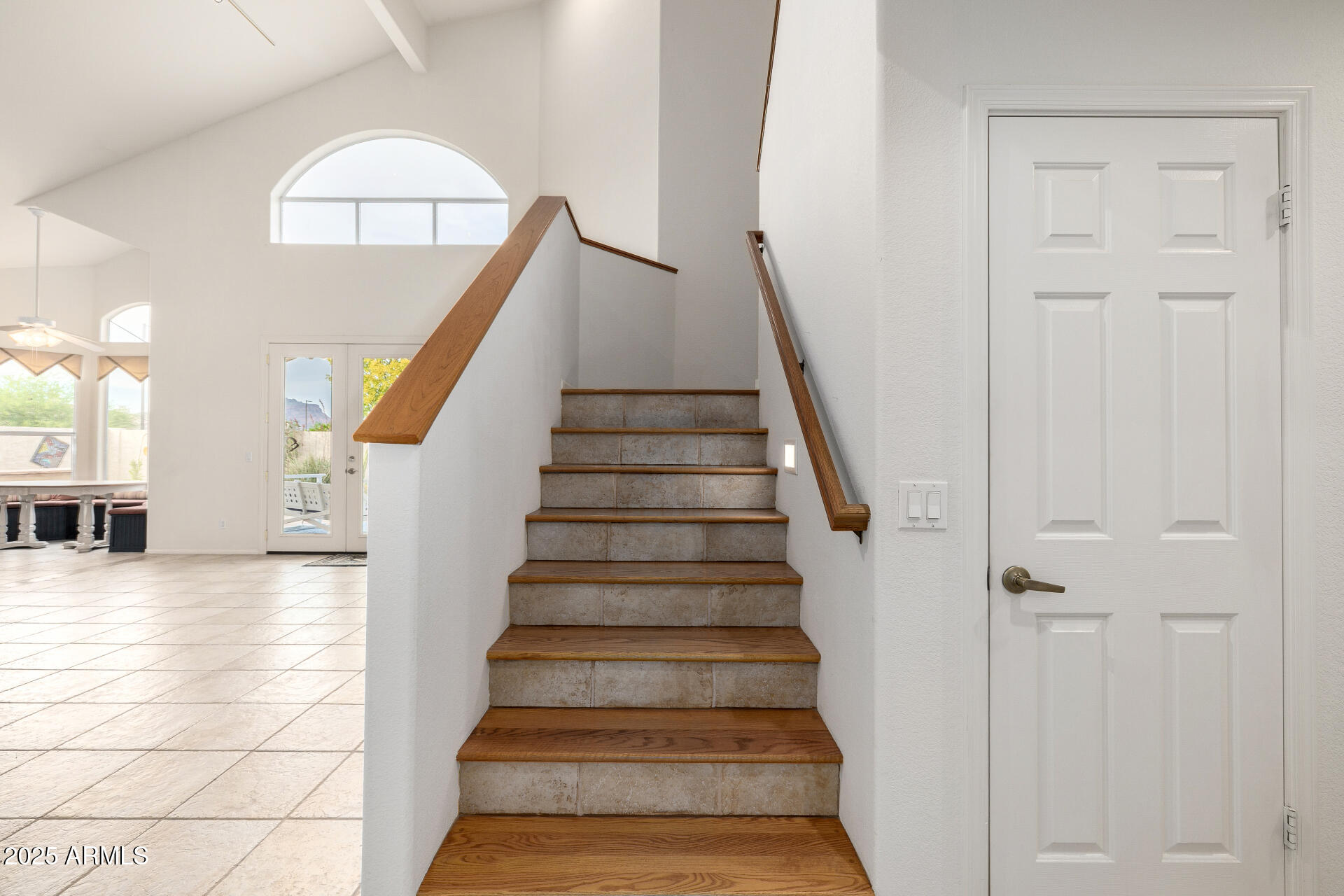 6726 East Villeroy Circle Mesa, AZ 85215 - Photo 31 of 74 a view of staircase with white walls and wooden floor