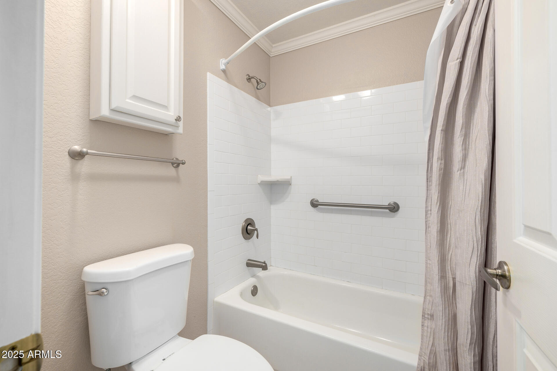 6726 East Villeroy Circle Mesa, AZ 85215 - Photo 36 of 74 a bath room with a toilet and a bath tub