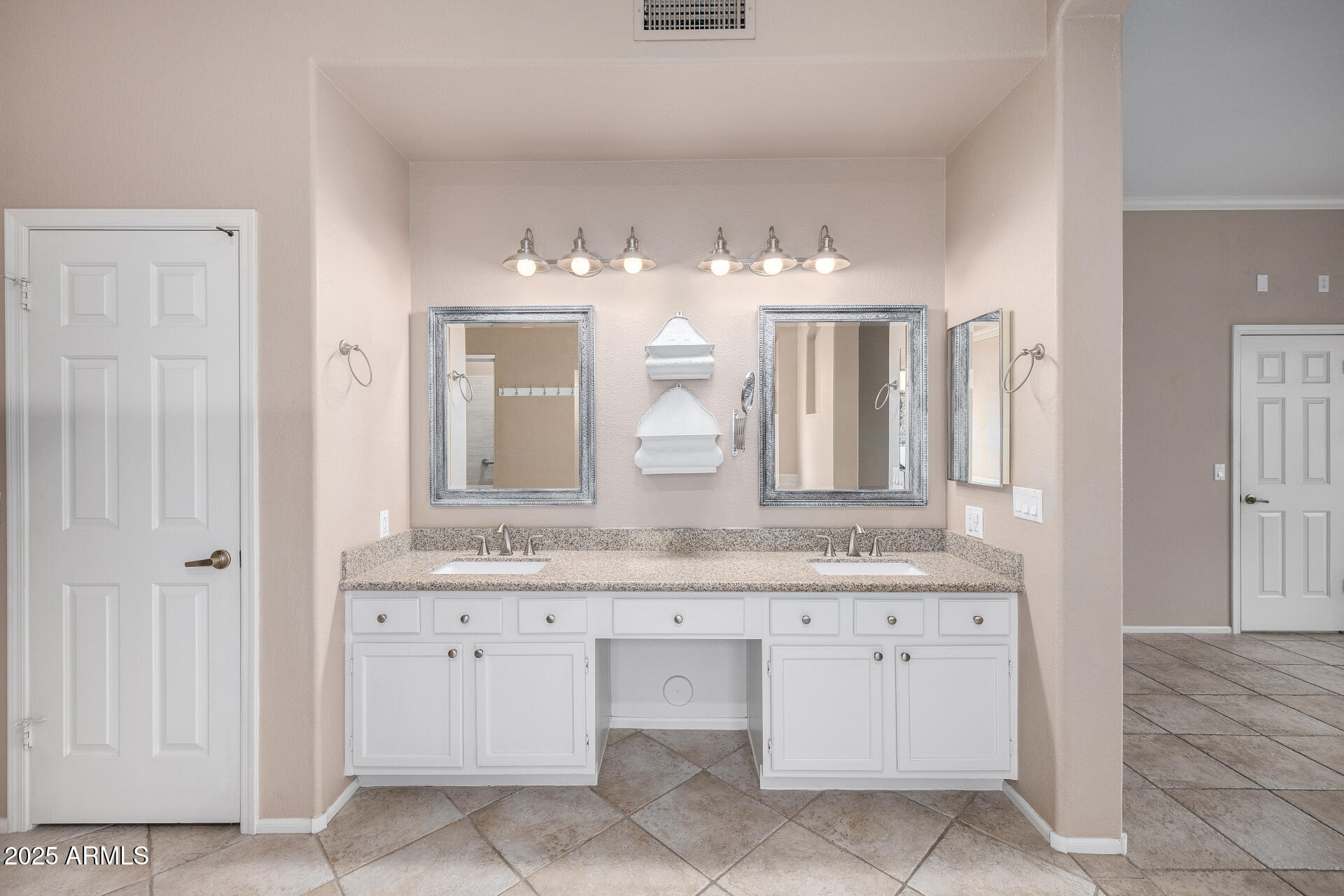 6726 East Villeroy Circle Mesa, AZ 85215 - Photo 42 of 74 a bathroom with a granite countertop sink two mirror and a
