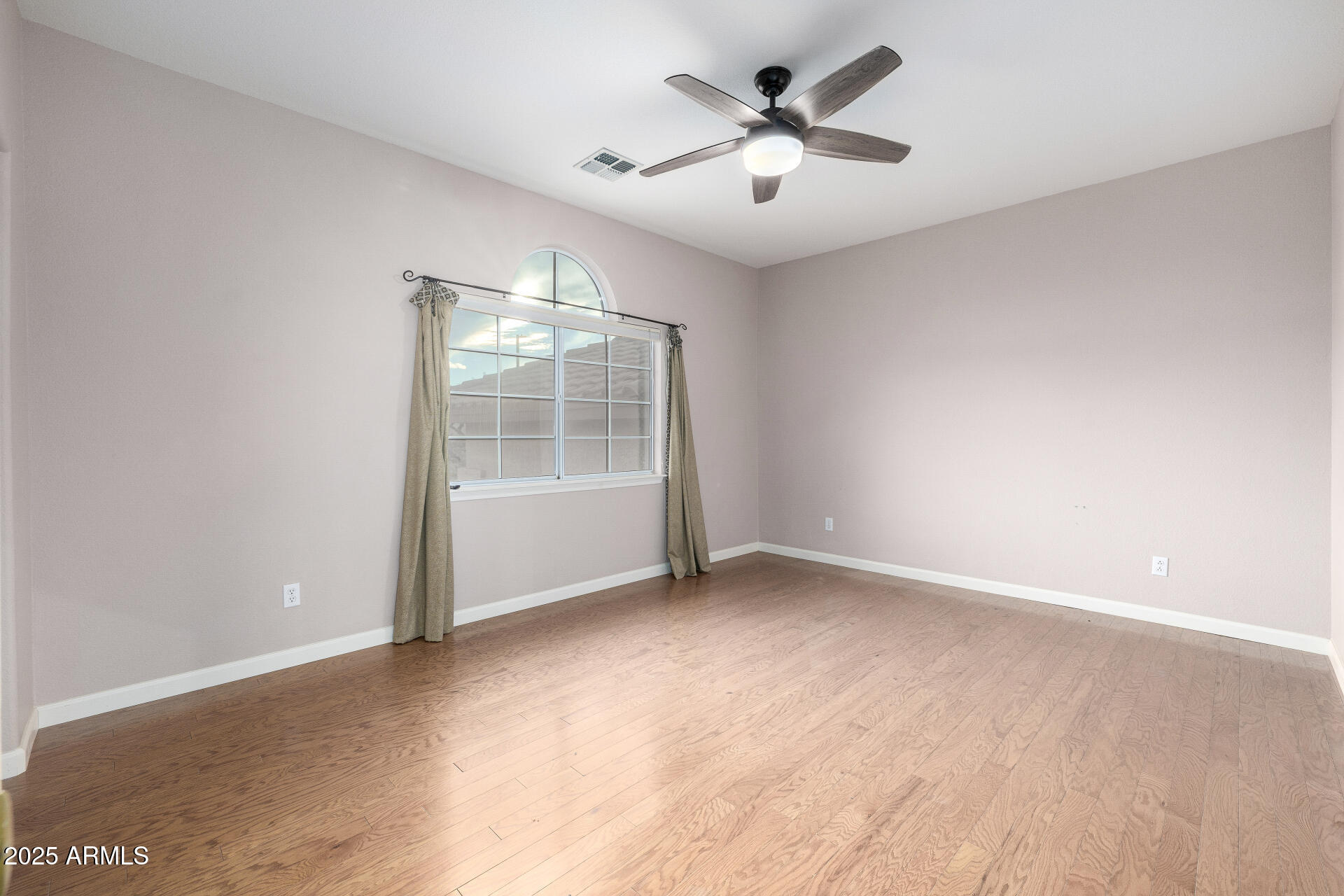 6726 East Villeroy Circle Mesa, AZ 85215 - Photo 50 of 74 an empty room with a empty space and a ceiling fan