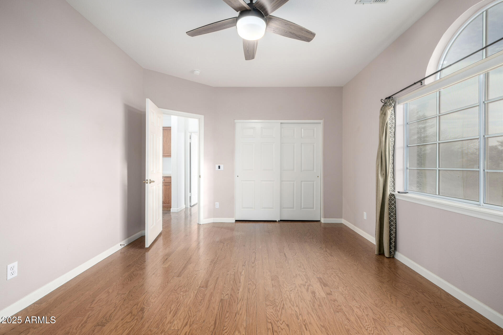 6726 East Villeroy Circle Mesa, AZ 85215 - Photo 51 of 74 wooden floor in an empty room with a window