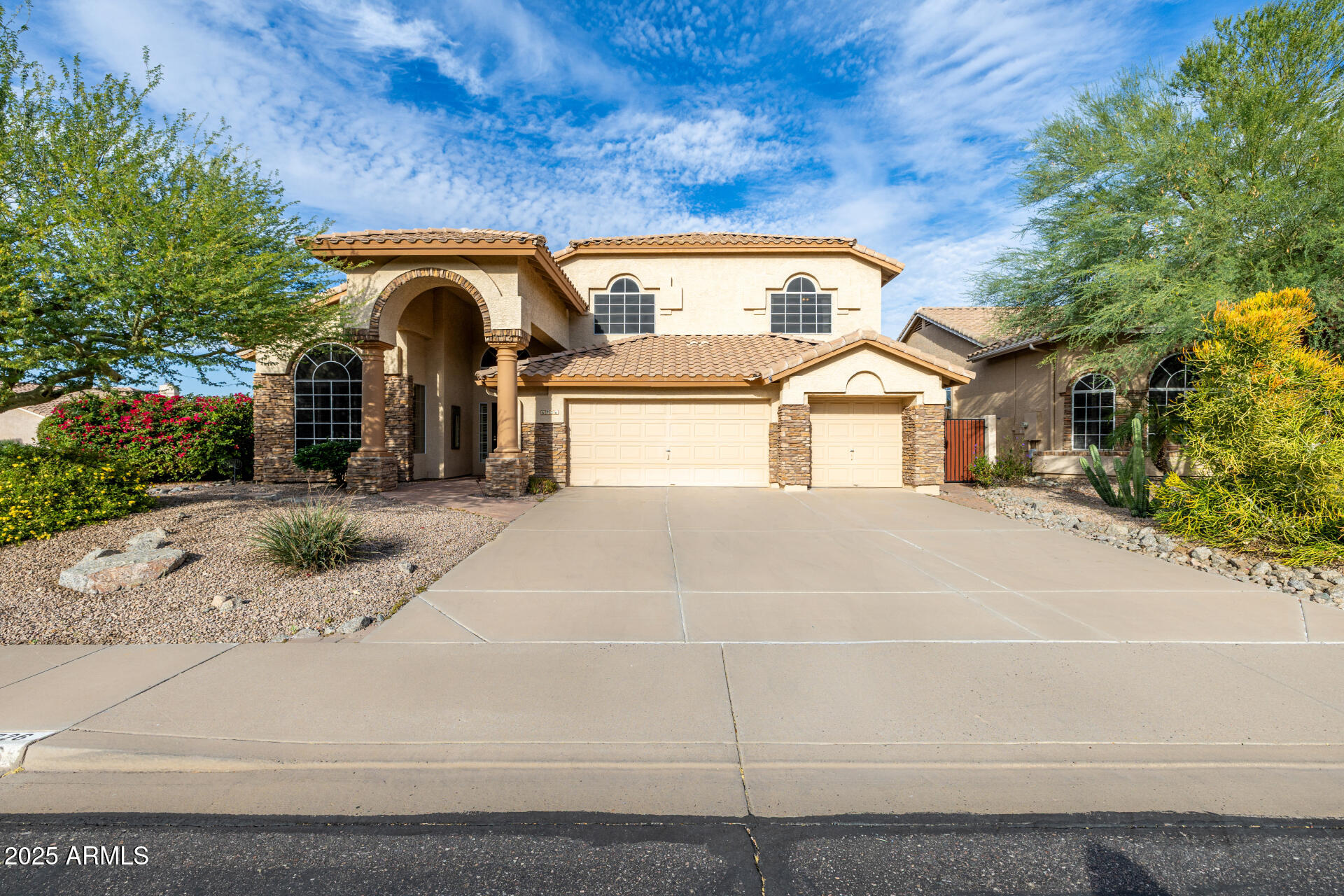 6726 East Villeroy Circle Mesa, AZ 85215 - Photo 7 of 74 a front view of a house with a garage