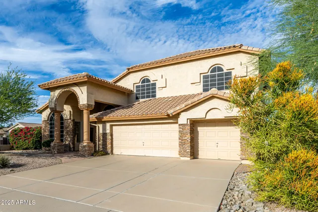 a view of a livingroom with wooden floor and a hallway