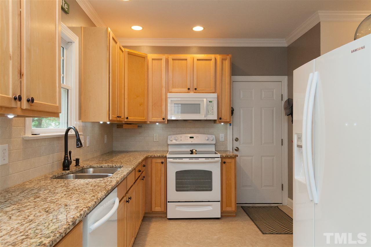 1005 Scotts Ridge Trail Apex, NC 27502 - Photo 8 of 25 New Appliances, Granite, New Hardware, New lighting, New faucet, Tile Backsplash