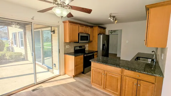 a view of livingroom and hallway with wooden floor