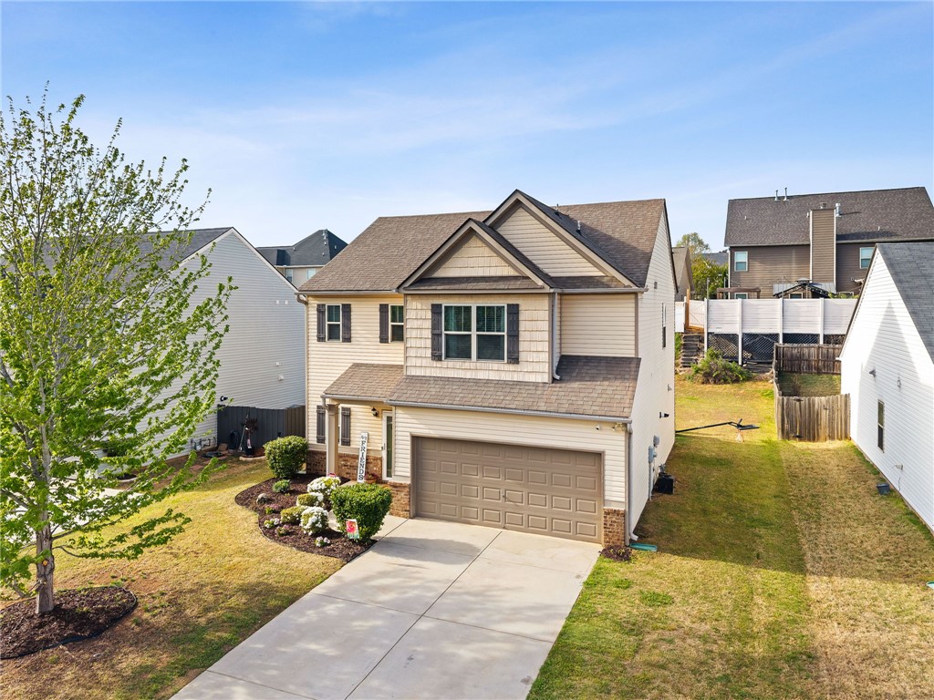 874 Wild Orchard Lane Woodruff, SC 29388 - Photo 34 of 35 This inviting home presents a warm facade with thoughtful landscaping, ready for new memories.