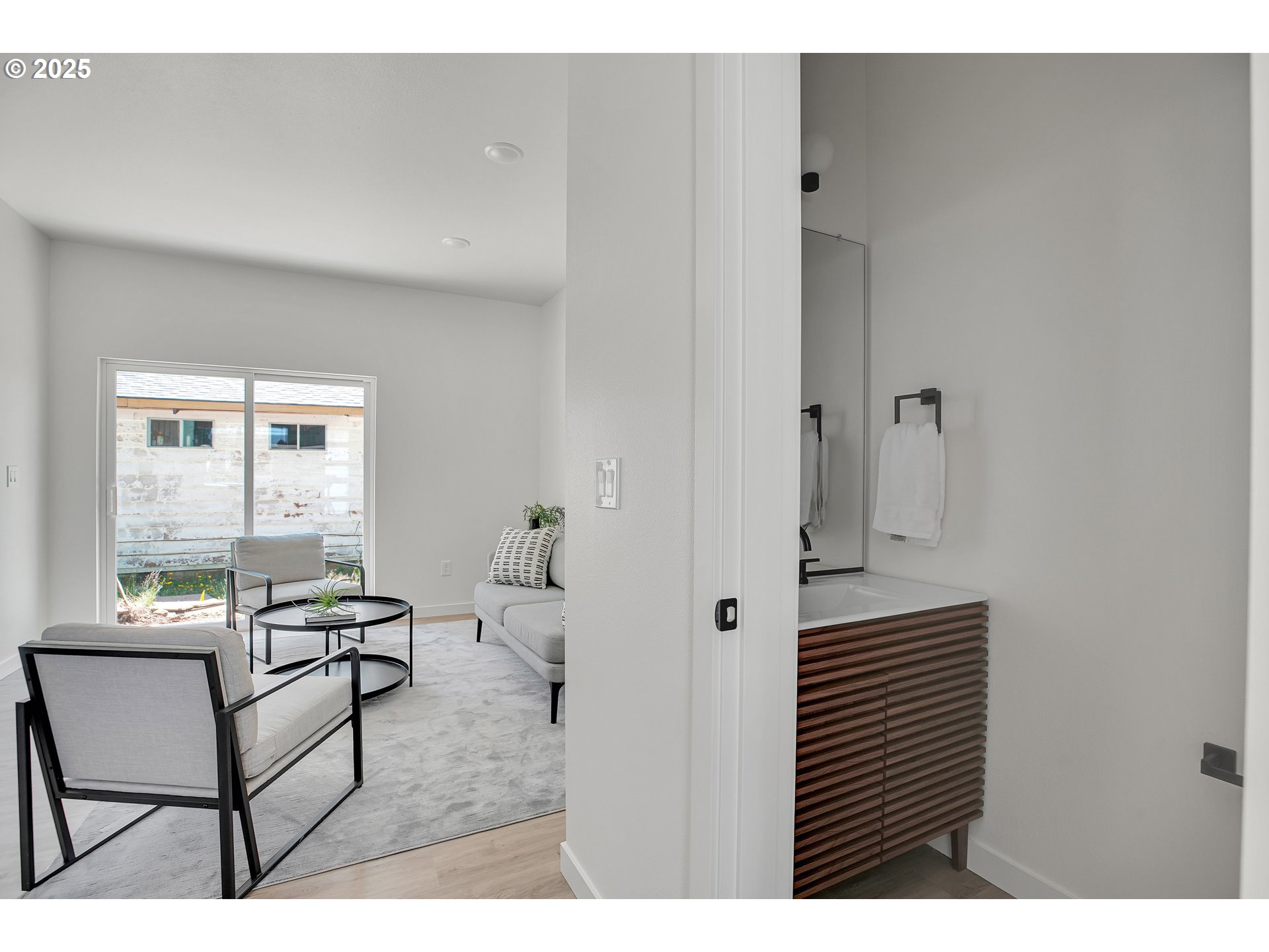 14828 Northeast Couch Street, Unit 5 Portland, OR 97230 - Photo 12 of 48 a living room with furniture and a window