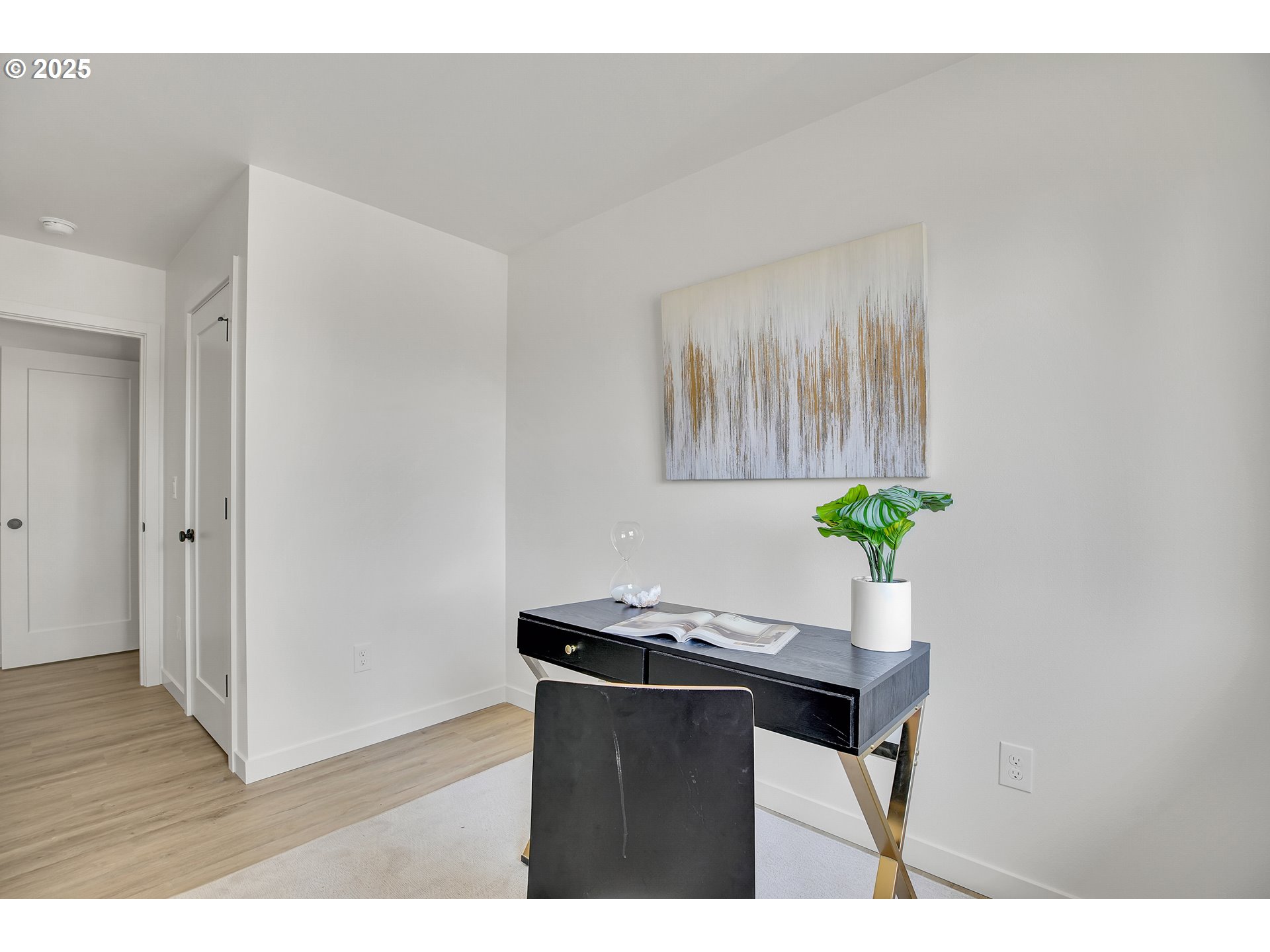 14828 Northeast Couch Street, Unit 5 Portland, OR 97230 - Photo 21 of 48 a room with furniture and a potted plant