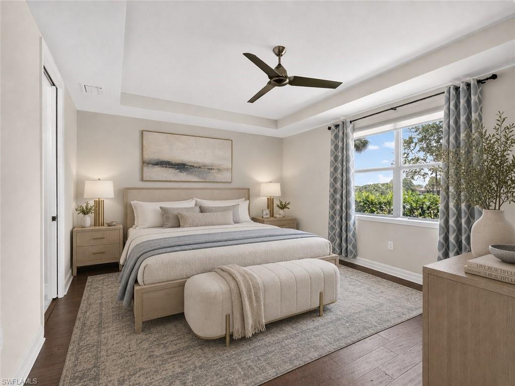 6124 Victory Drive Ave Maria, FL 34142 - Photo 11 of 50 a bedroom with a large bed and a large window